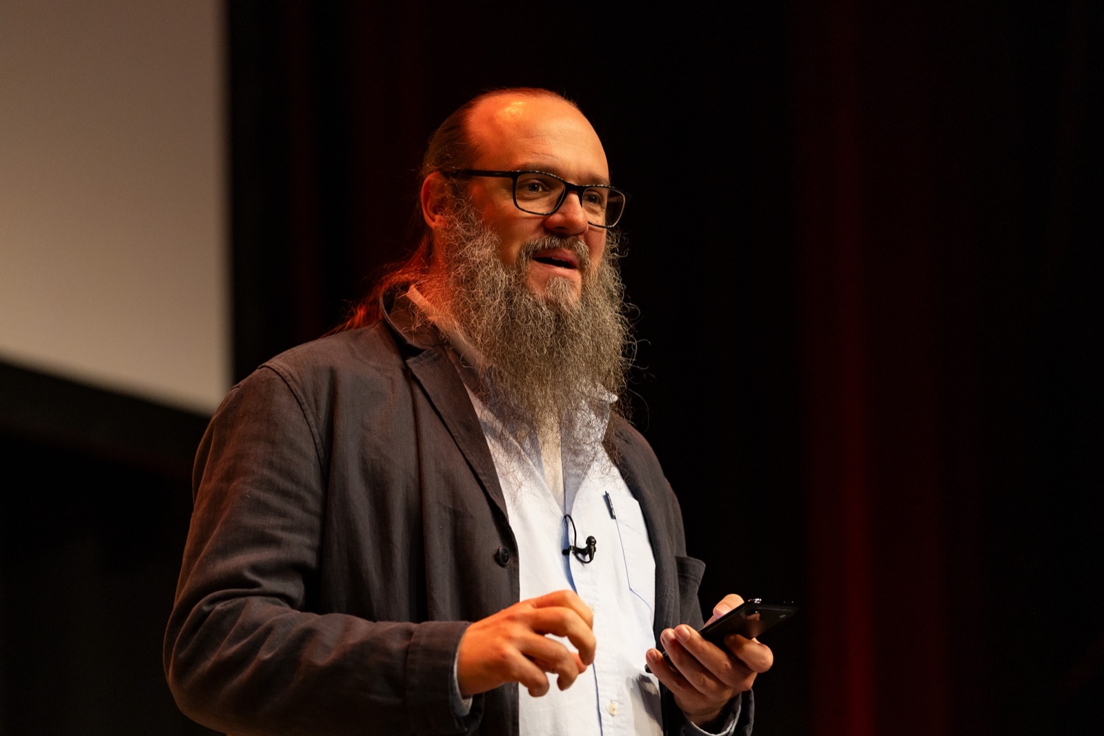Danny Hope speaking on stage at UX Brighton, November 2025
